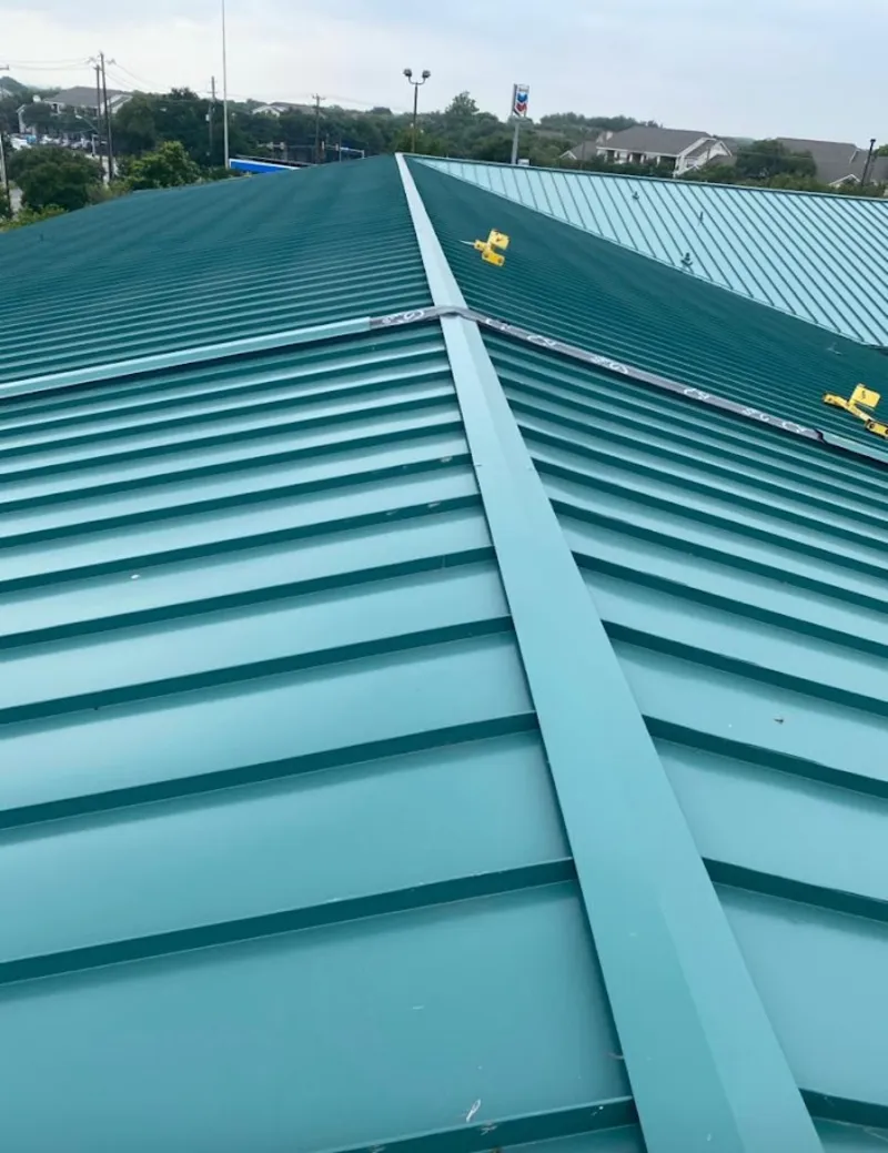 Green commercial metal roof ridge and valley for Metal Roof Repair in Barrington