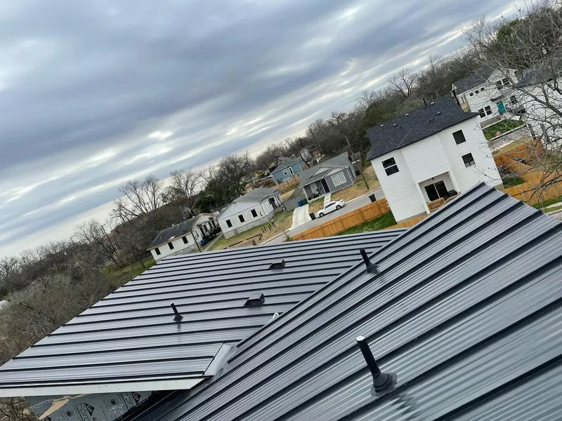 Standing seam metal roof panels with vents for Skylight Repair in Barrington
